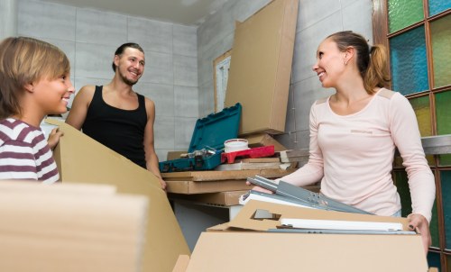 Removal team planning a Streatham home move with boxes and furniture