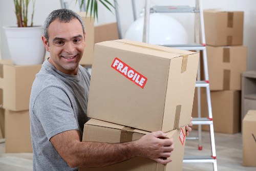 Loading household items into a removal van carefully